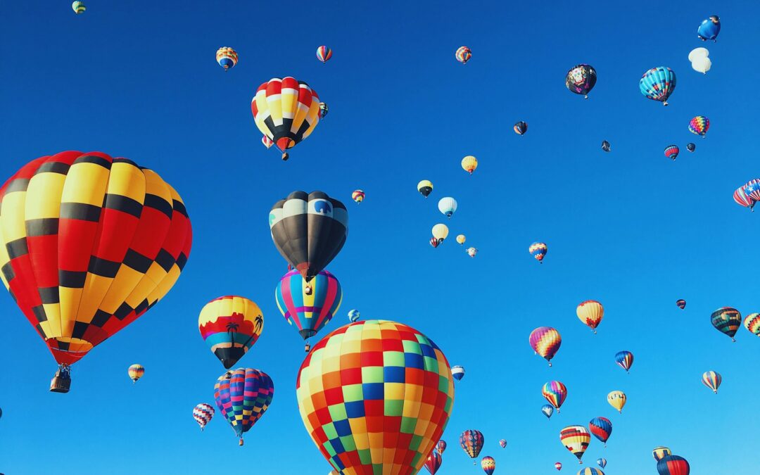 Hot air balloons in a blue sky